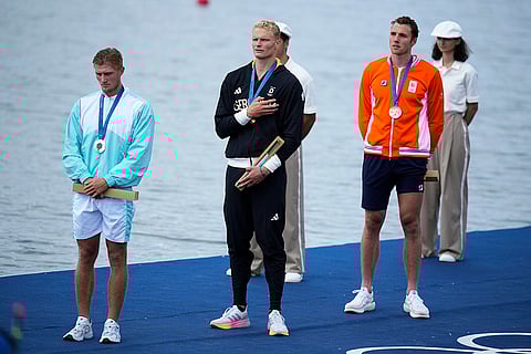 Men's single sculls rowing: Gold medalist, Oliver Zeidler, of Germany, silver medalist, Individual Neutral athlete Yauheni Zalaty and bronze medalist Simon van Dorp, of Netherlands